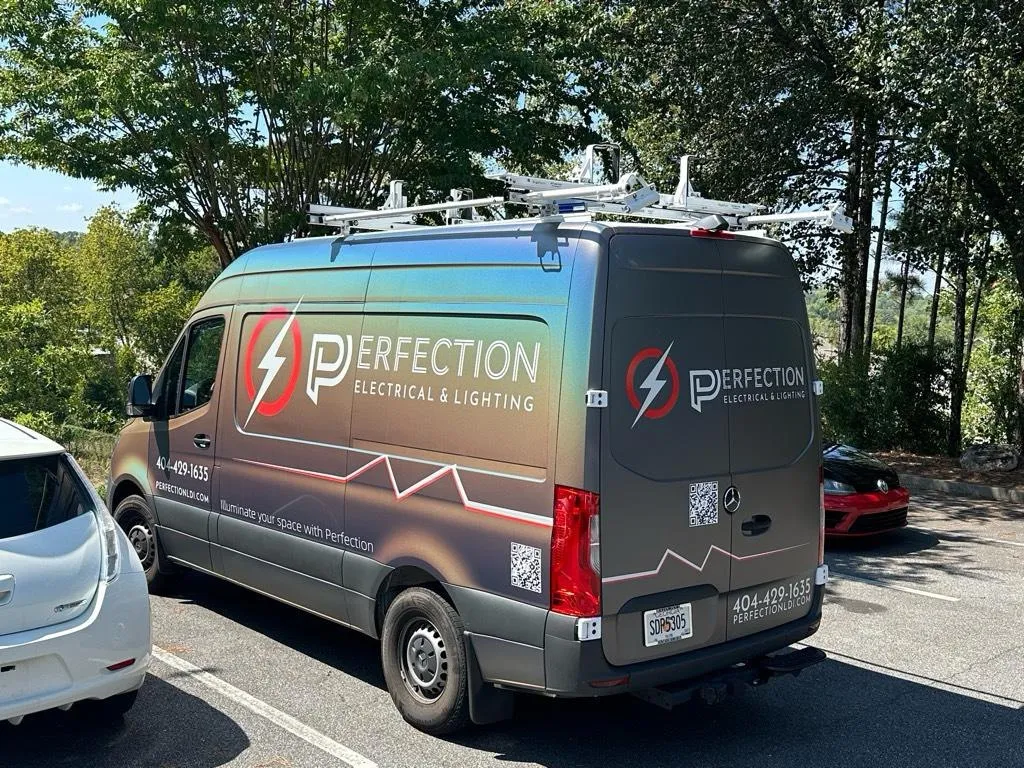 Perfection Electrical service van with the installed wrap, on the road